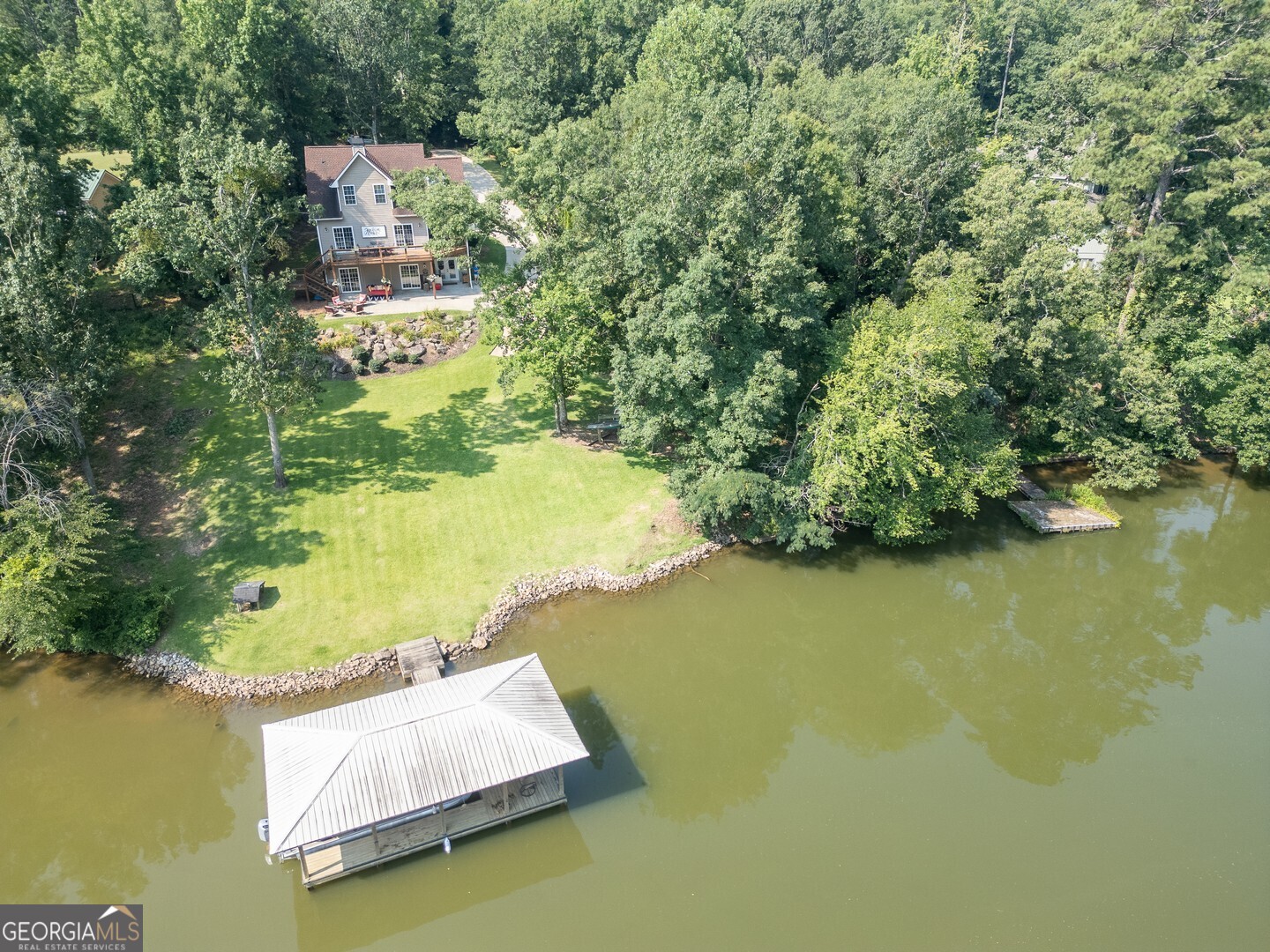 734 Raven Road Monticello, GA 31064 - Photo 2 of 81 an aerial view of residential houses with outdoor space and swimming pool
