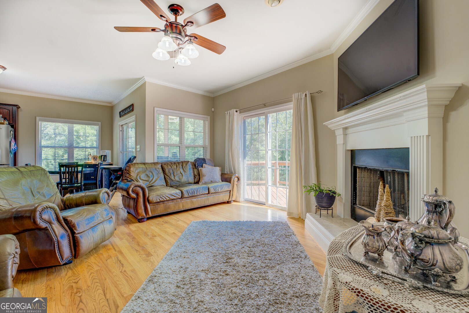734 Raven Road Monticello, GA 31064 - Photo 32 of 81 a living room with furniture and a flat screen tv