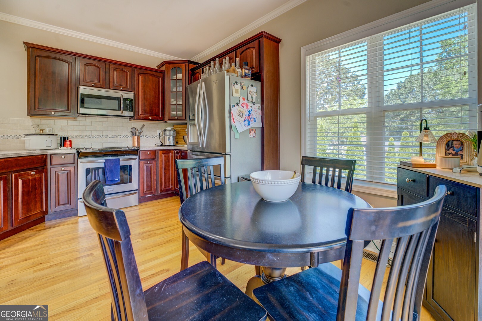 734 Raven Road Monticello, GA 31064 - Photo 40 of 81 a view of a dining room with furniture window and wooden floor