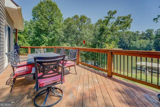 an aerial view of a house with swimming pool and outdoor space