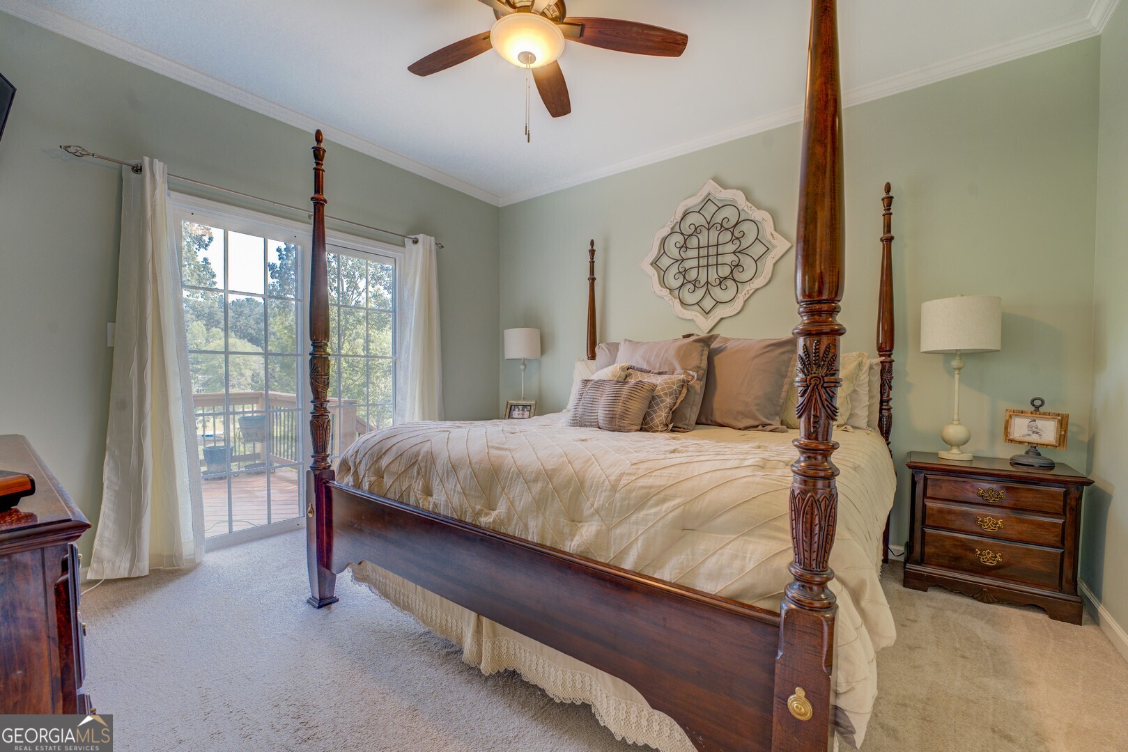 734 Raven Road Monticello, GA 31064 - Photo 42 of 81 a bedroom with a bed and a chandelier