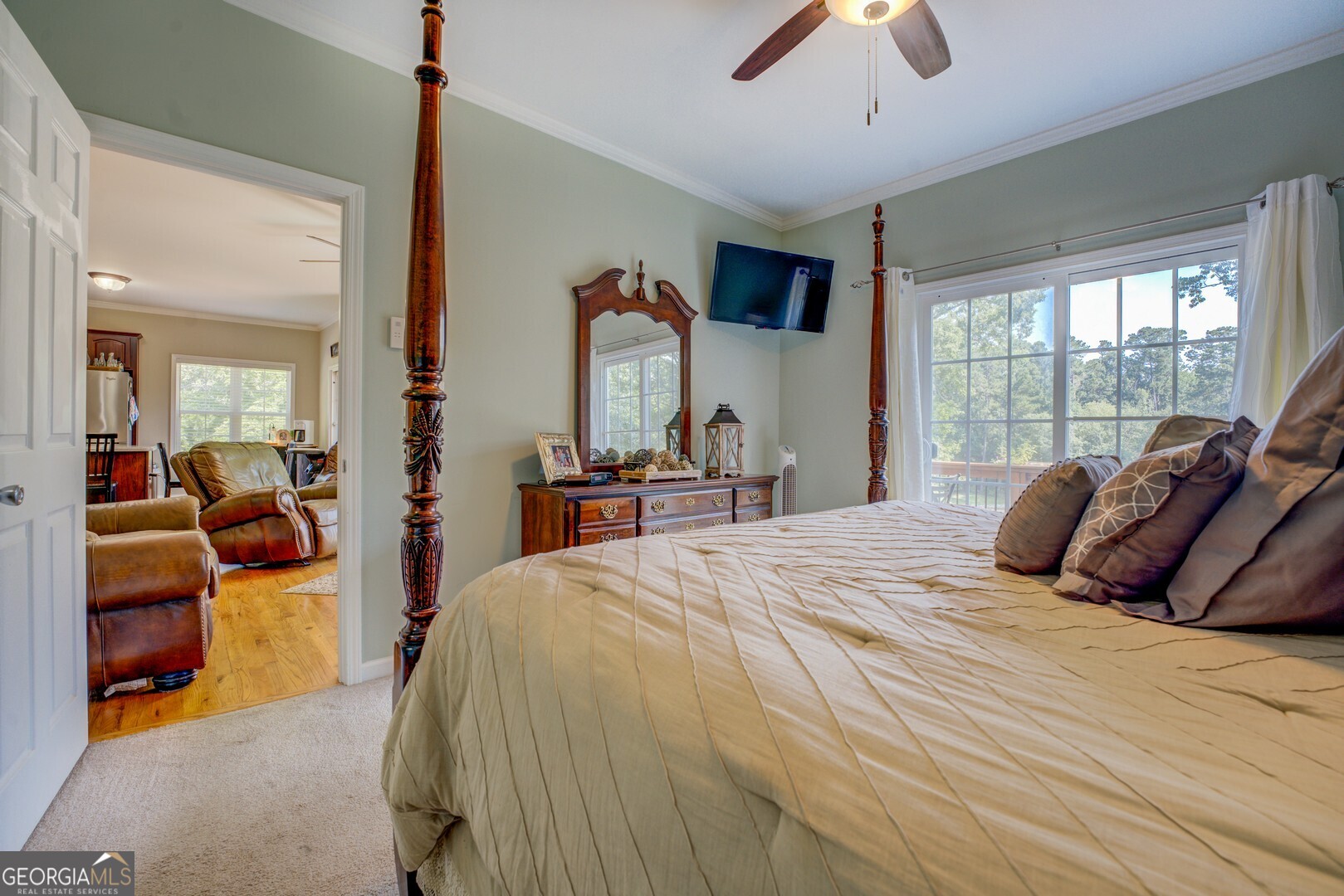 734 Raven Road Monticello, GA 31064 - Photo 43 of 81 a bedroom with a bed and a chandelier