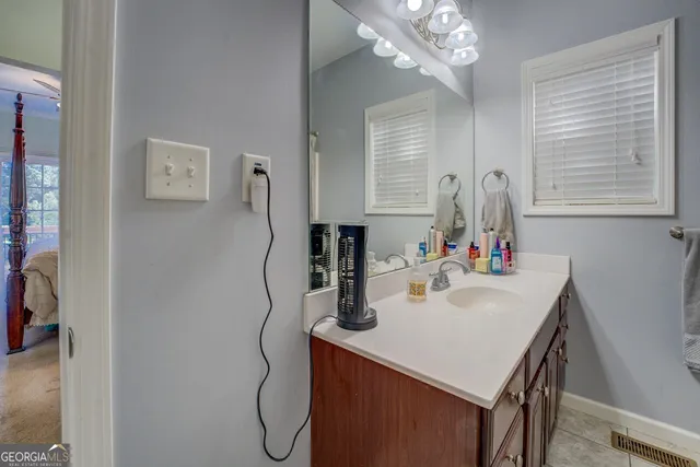 a bathroom with a shower and a sink