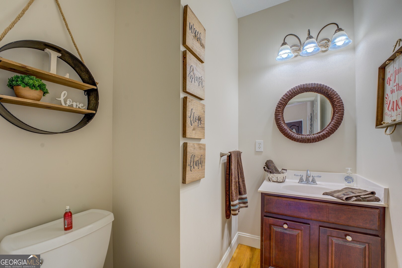 734 Raven Road Monticello, GA 31064 - Photo 50 of 81 a bathroom with a toilet a sink and a mirror
