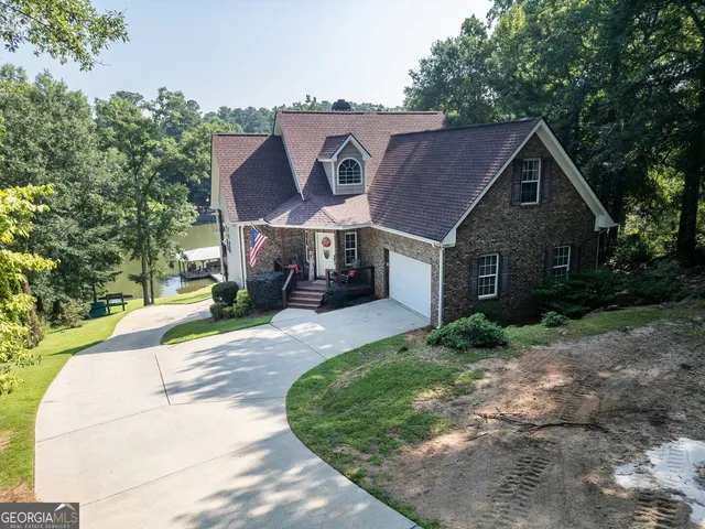 a view of a lake with a yard and mountain view