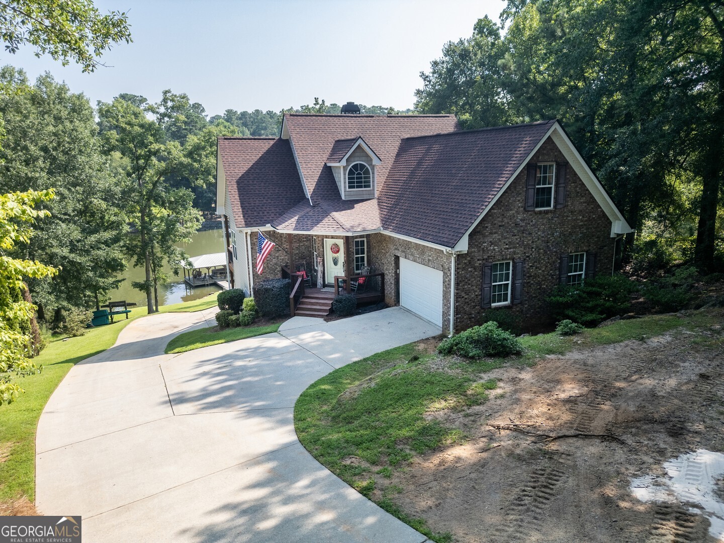 734 Raven Road Monticello, GA 31064 - Photo 5 of 81 a front view of a house with a yard and trees