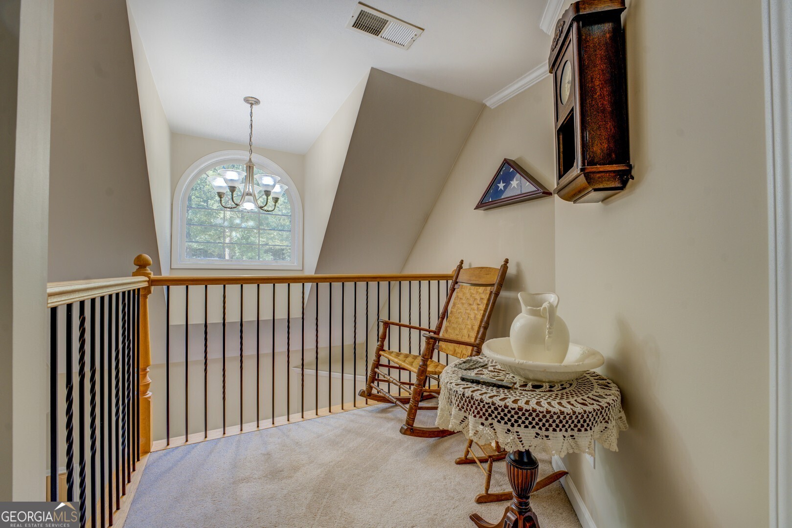 734 Raven Road Monticello, GA 31064 - Photo 58 of 81 a view of a hallway with windows and chandelier