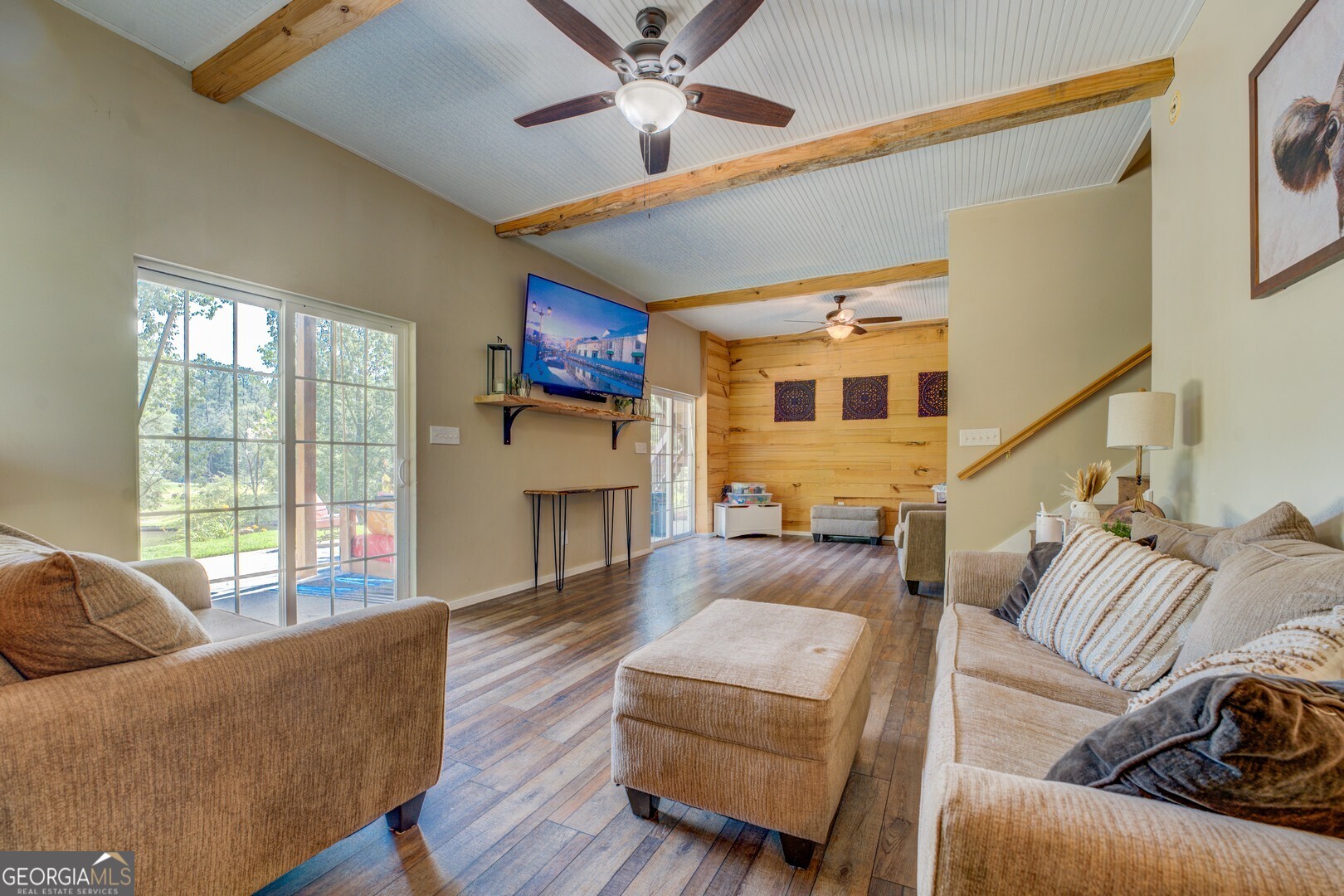 734 Raven Road Monticello, GA 31064 - Photo 66 of 81 a living room with furniture and a floor to ceiling window
