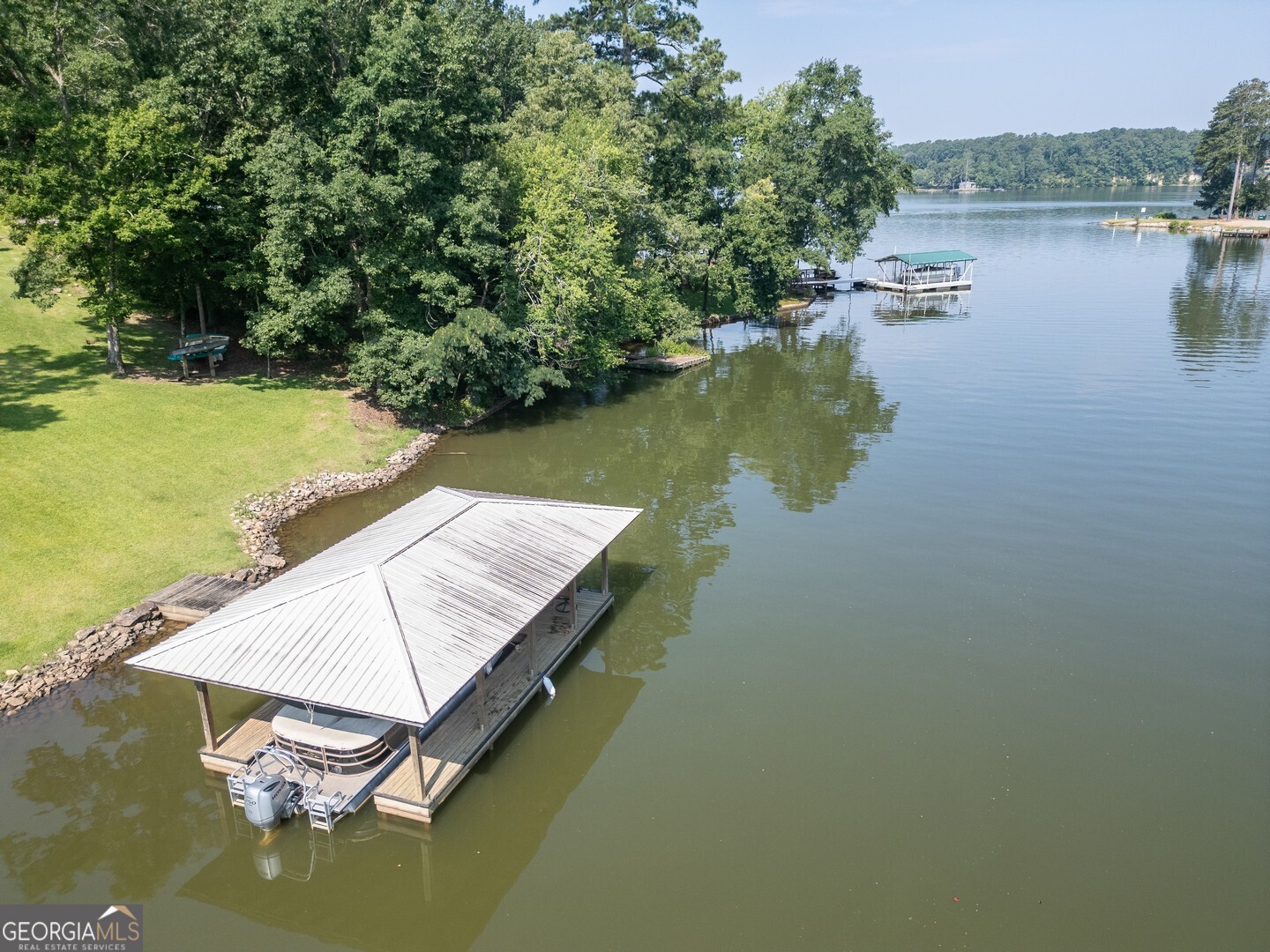 734 Raven Road Monticello, GA 31064 - Photo 10 of 81 a view of a lake with houses in the back