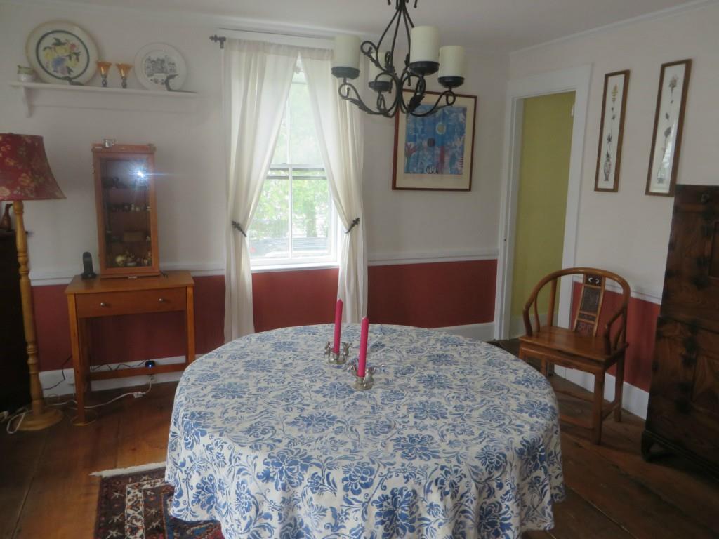 Large dining room with wide pine...