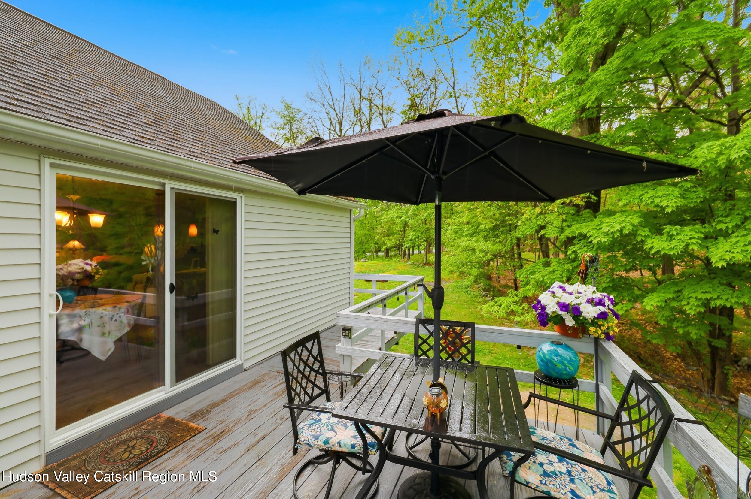 186 Cedar Hill Road High Falls, NY 12440 - Photo 28 of 33 a view of an outdoor sitting area with furniture and umbrella