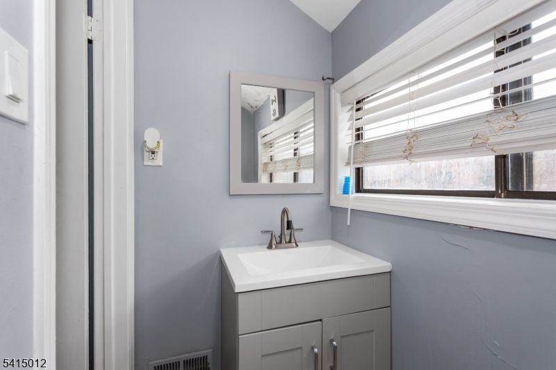 40 Bennington Square Hackettstown, NJ 07840 - Photo 12 of 23 a bathroom with a sink and a mirror