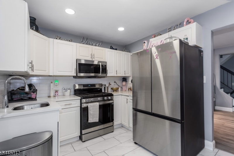 40 Bennington Square Hackettstown, NJ 07840 - Photo 8 of 23 a kitchen with stainless steel appliances granite countertop a refrigerator sink and stove