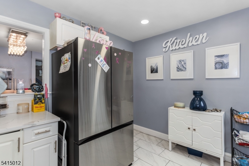 40 Bennington Square Hackettstown, NJ 07840 - Photo 10 of 23 a kitchen with a refrigerator and cabinets