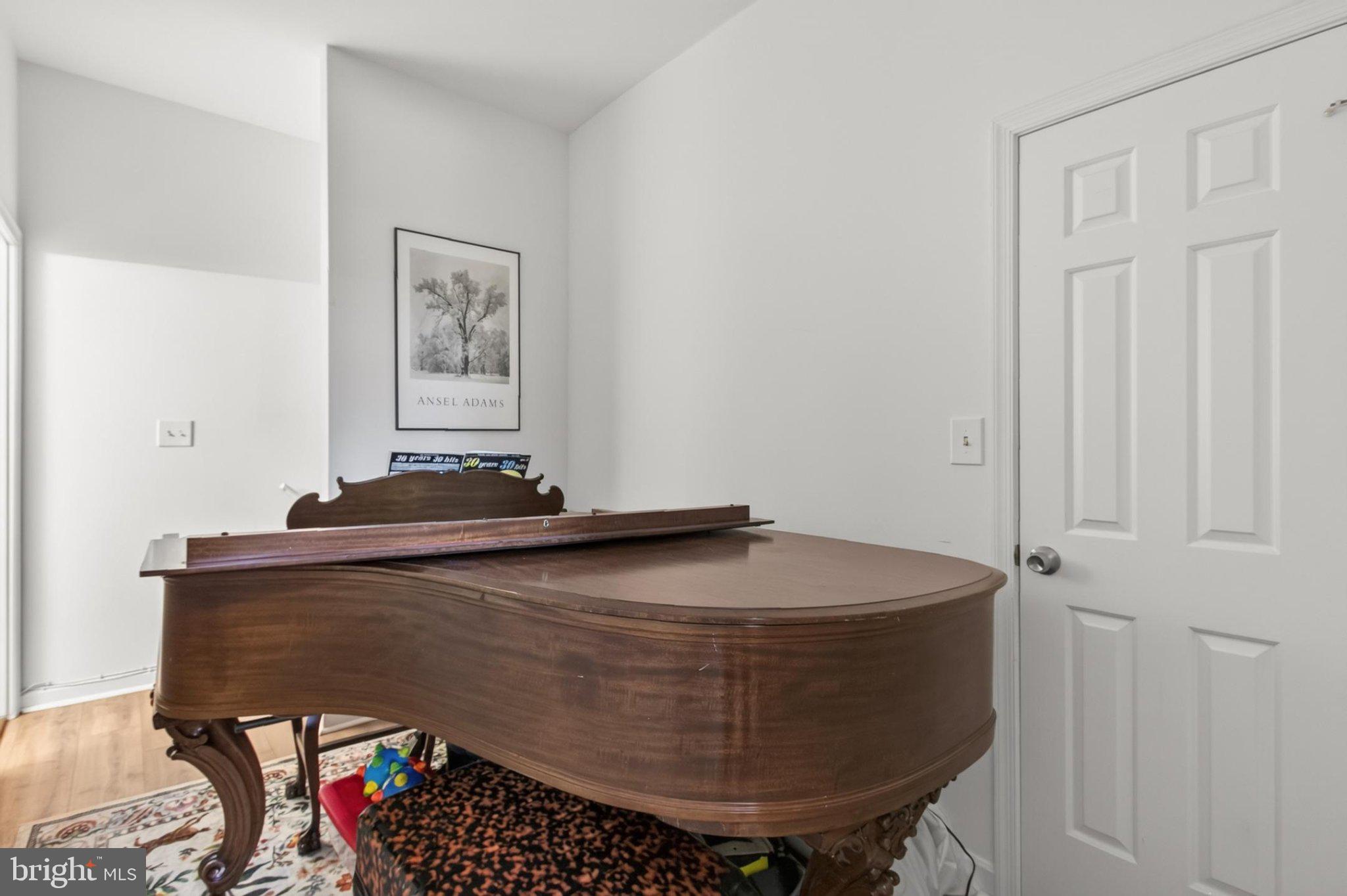 738 11th Street Northeast, Unit 1 Washington, DC 20002 - Photo 15 of 21 Elegant grand piano in a bright space.