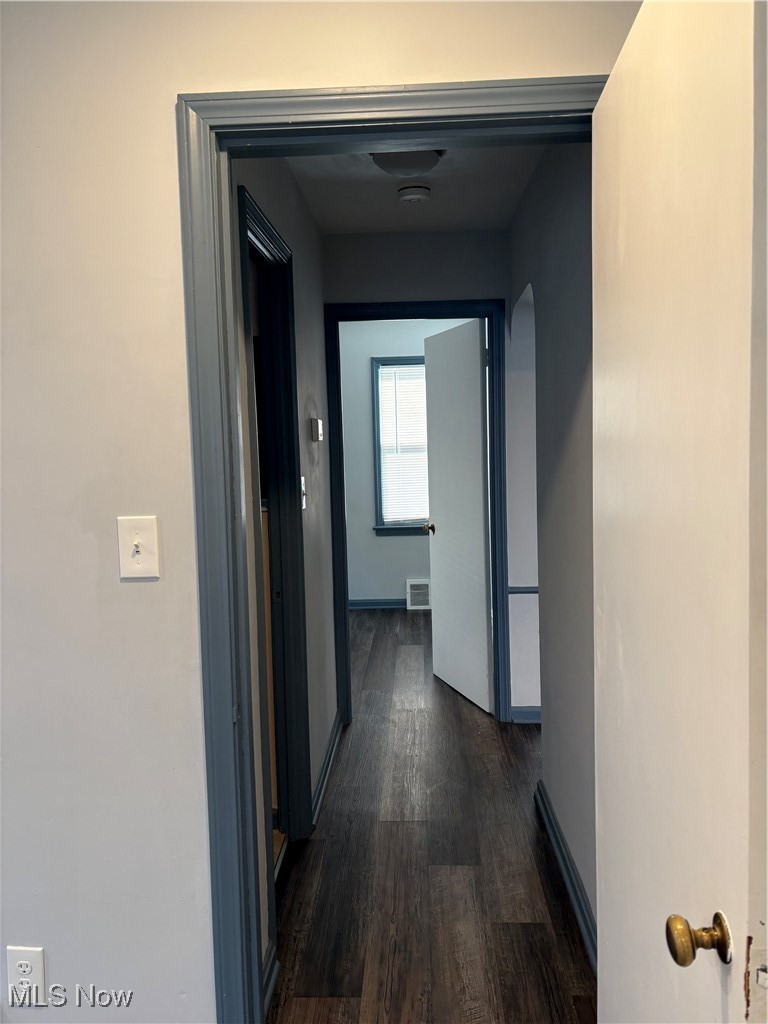 17914 Libby Road Maple Heights, OH 44137 - Photo 13 of 17 Corridor featuring dark wood-style floors