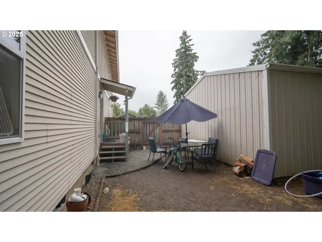 a backyard of a house with outdoor seating