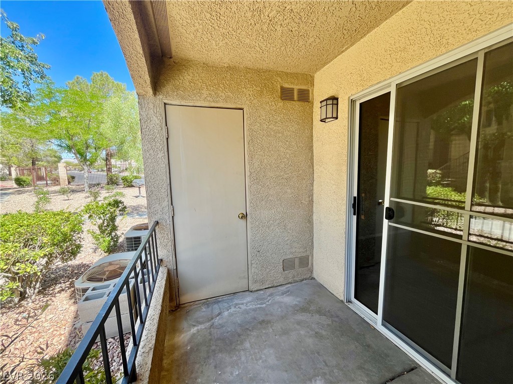 7885 West Flamingo Road, Unit 1029 Las Vegas, NV 89147 - Photo 17 of 18 An inviting private patio offers serene views of mature landscaping.