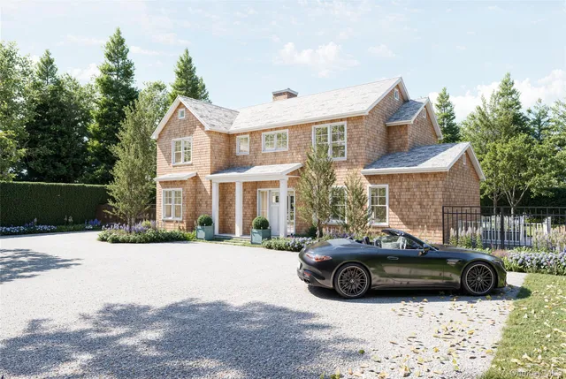 a car parked in front of a white house