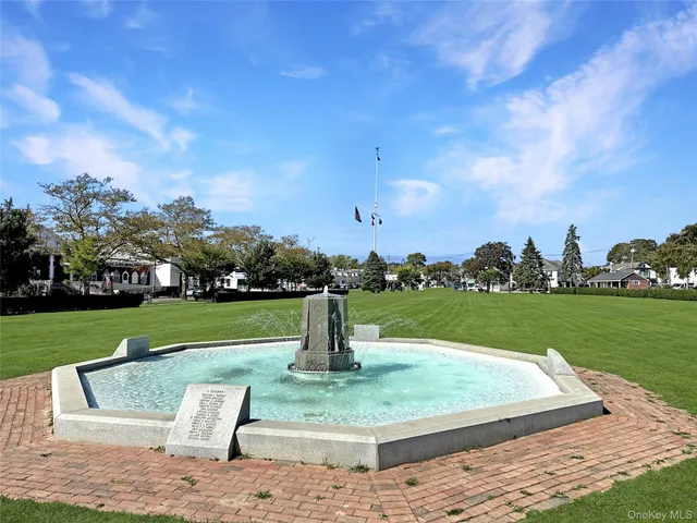 a view of a park with houses