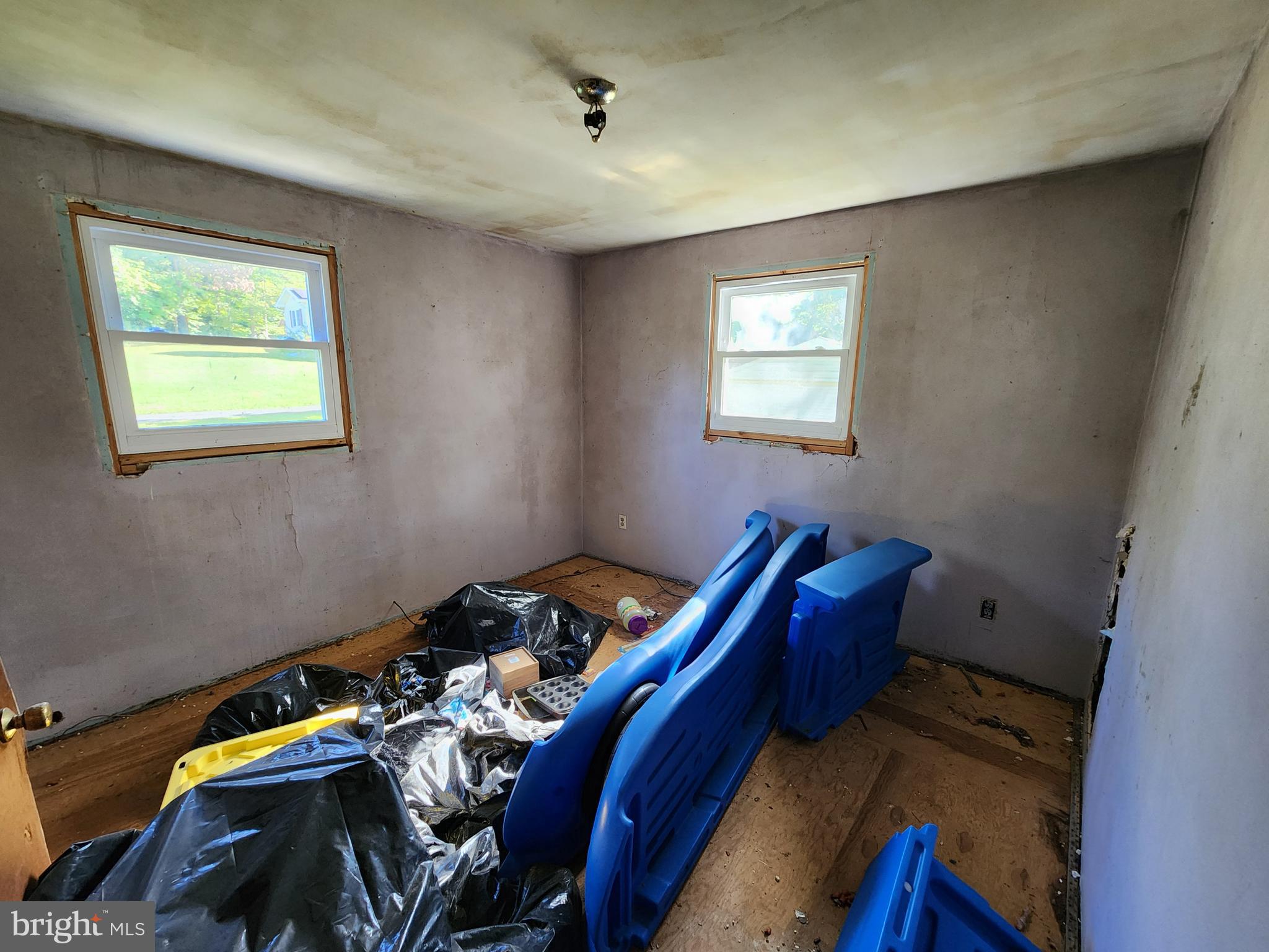 2616 Old Elk Neck Road Elkton, MD 21921 - Photo 21 of 25 a bed sitting in a bedroom next to a window