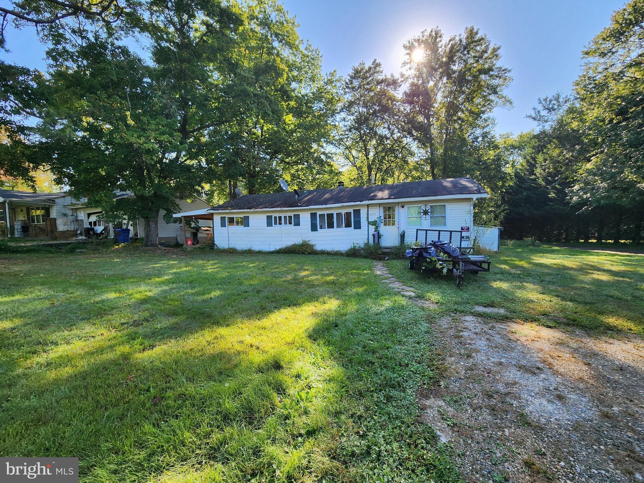 2616 Old Elk Neck Road Elkton, MD 21921 - Photo 3 of 25 a view of a house with a big yard and large trees