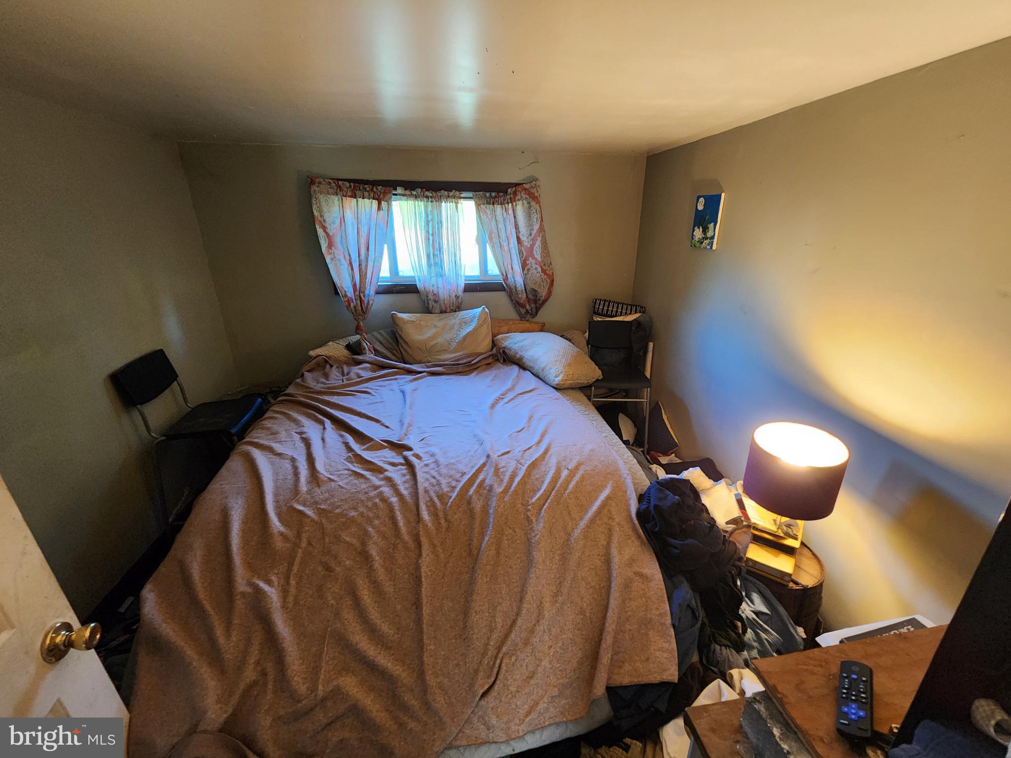 2616 Old Elk Neck Road Elkton, MD 21921 - Photo 7 of 25 a bed sitting in a bedroom next to a window