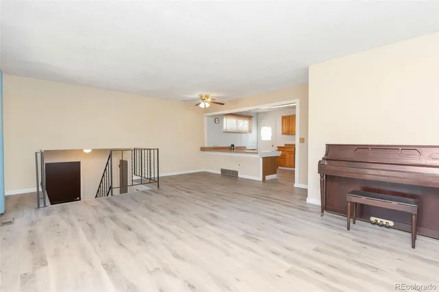 a view of a kitchen with a sink and cabinets
