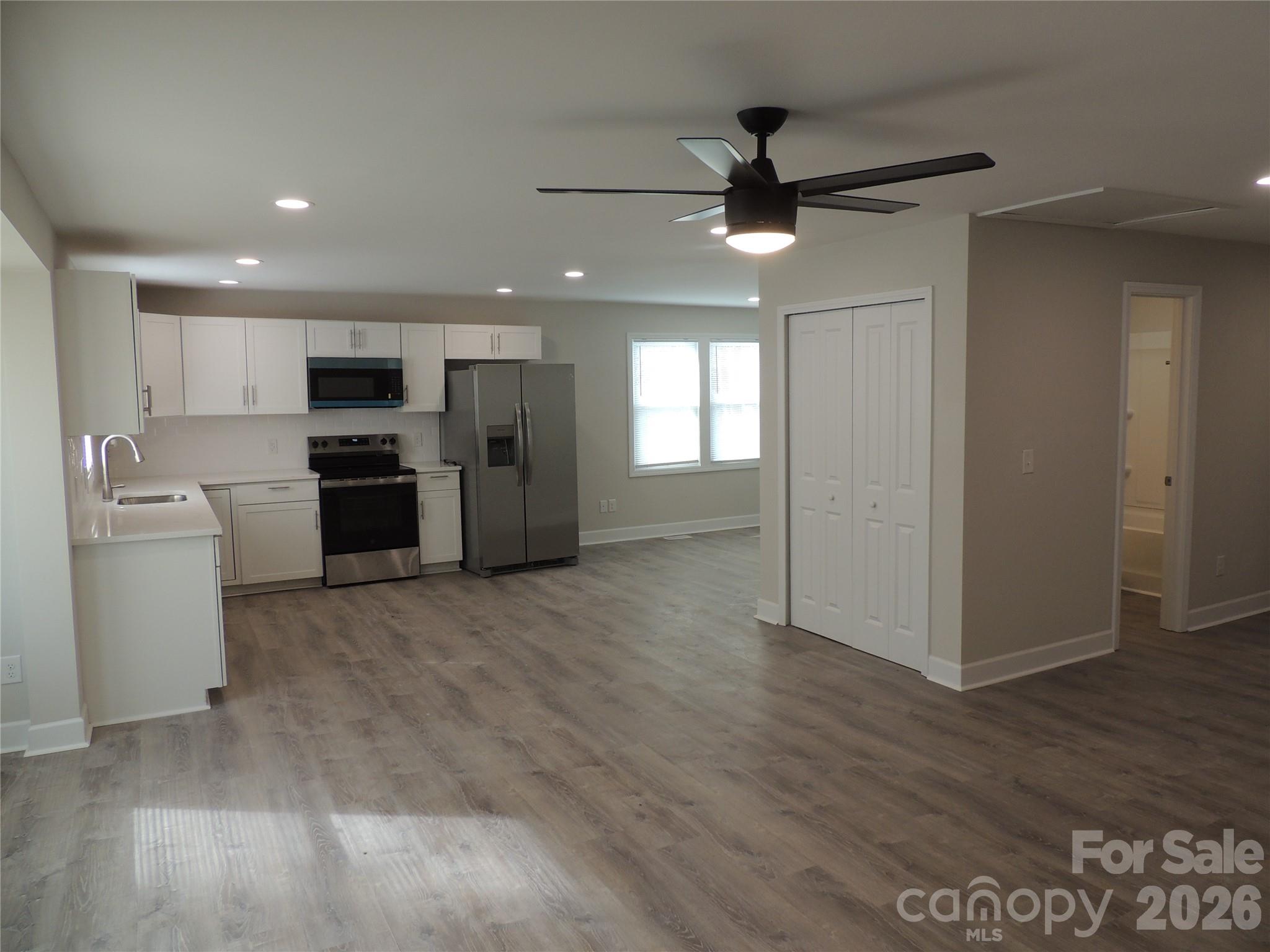 146 Loomis Street Chester, SC 29706 - Photo 2 of 12 a view of a kitchen with a sink and a refrigerator