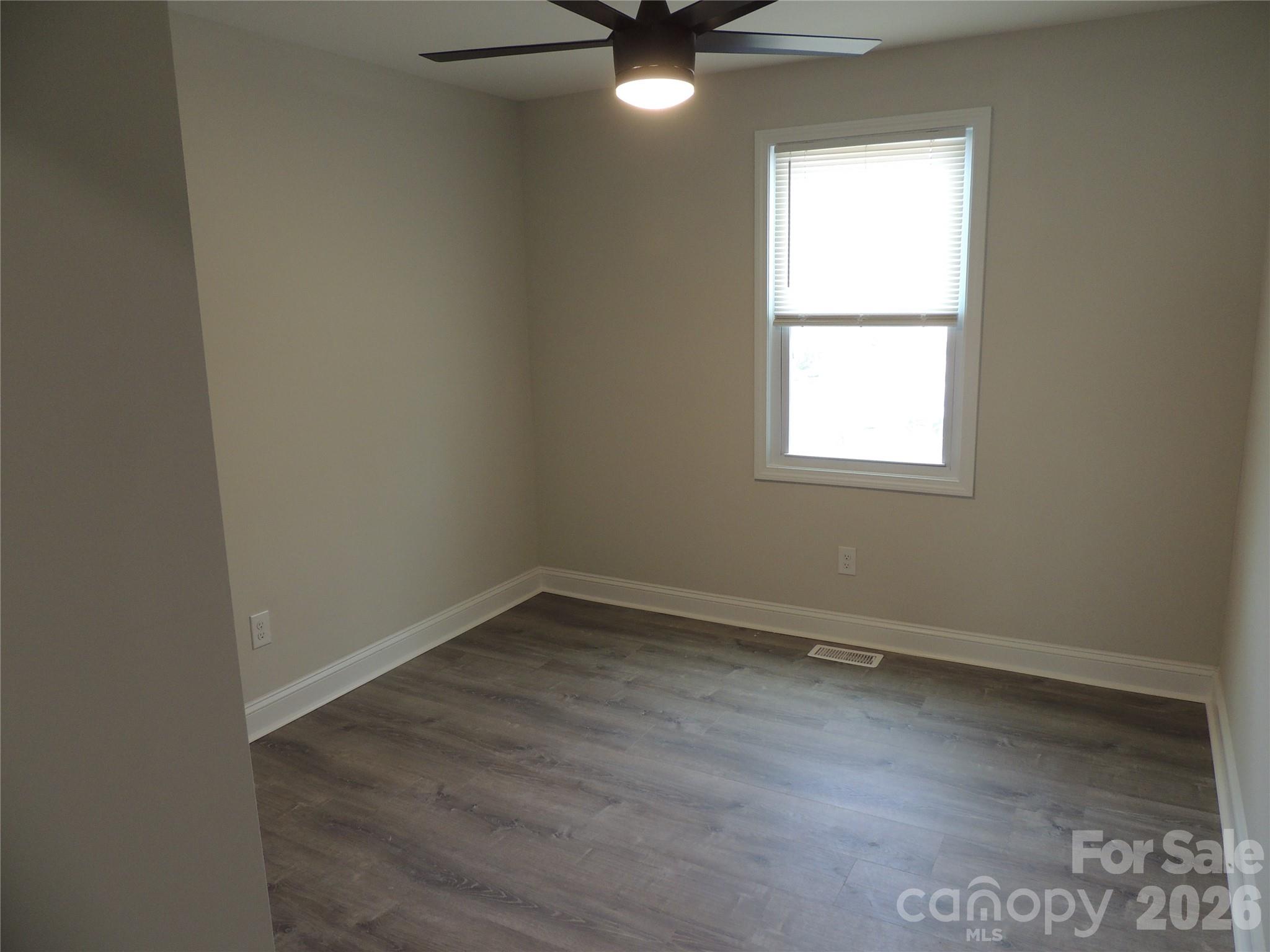 146 Loomis Street Chester, SC 29706 - Photo 8 of 12 an empty room with a window and a fan