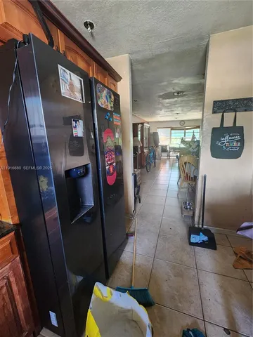 a view of water heater room with a washer and dryer