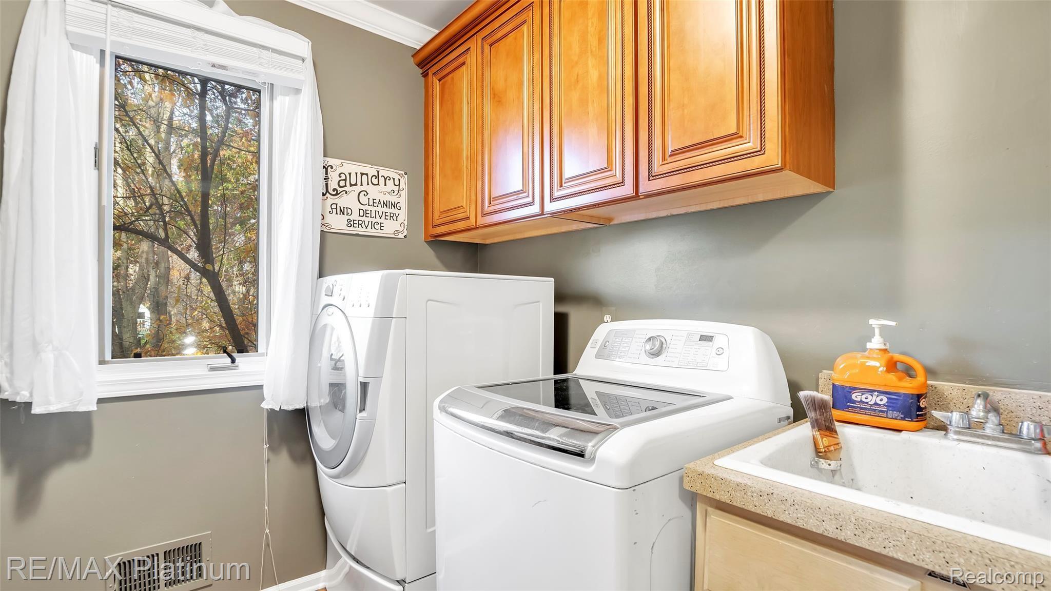 2439 Sunny Ridge Drive Pinckney, MI 48169 - Photo 16 of 42 First Floor Laundry Room
