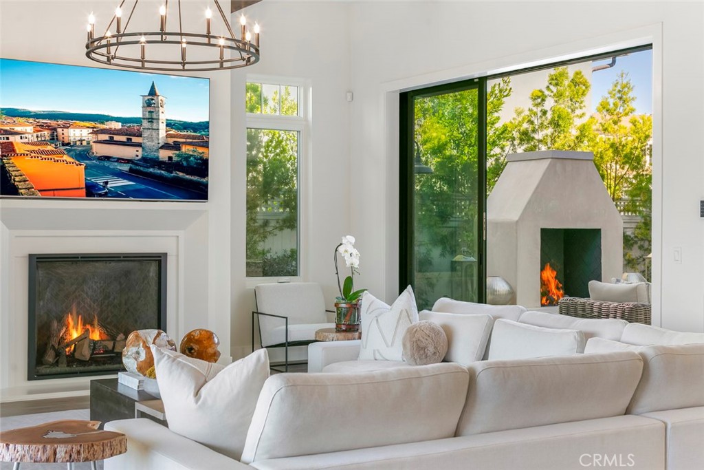 5 Rancho Elastico Road Rolling Hills Estates, CA 90274 - Photo 4 of 48 a living room with furniture and a fireplace