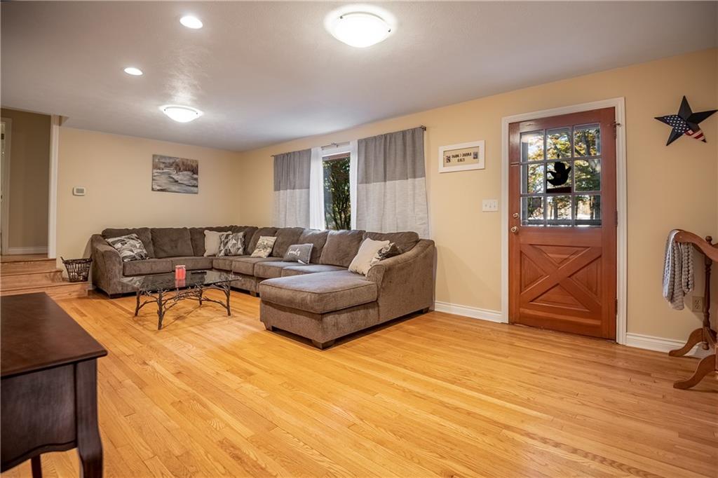 625 Stateline Road Bessemer, PA 16112 - Photo 3 of 19 a living room with a couch and dresser with wooden floor