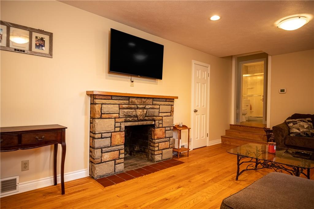 625 Stateline Road Bessemer, PA 16112 - Photo 4 of 19 a living room with furniture and a fireplace