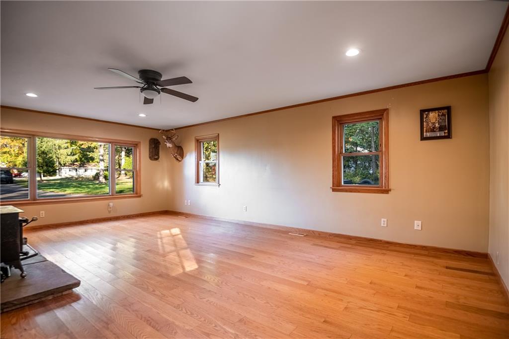 625 Stateline Road Bessemer, PA 16112 - Photo 8 of 19 a view of livingroom with hardwood floor and ceiling fan