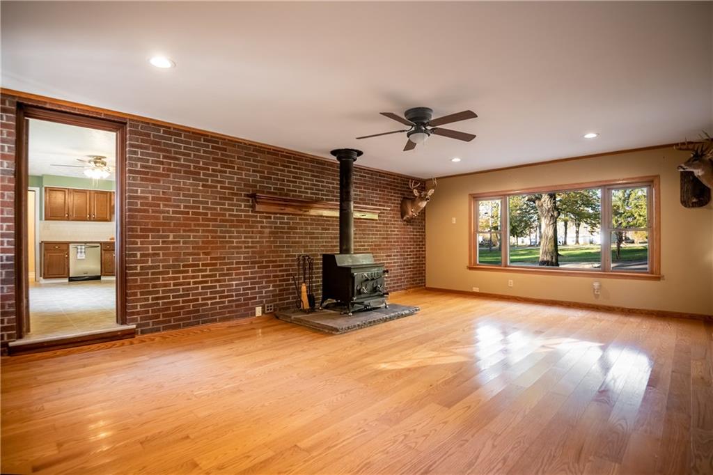 625 Stateline Road Bessemer, PA 16112 - Photo 9 of 19 a view of a livingroom with a fireplace and a large window