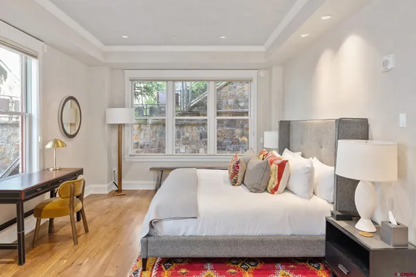 a bedroom with a bed and a couch