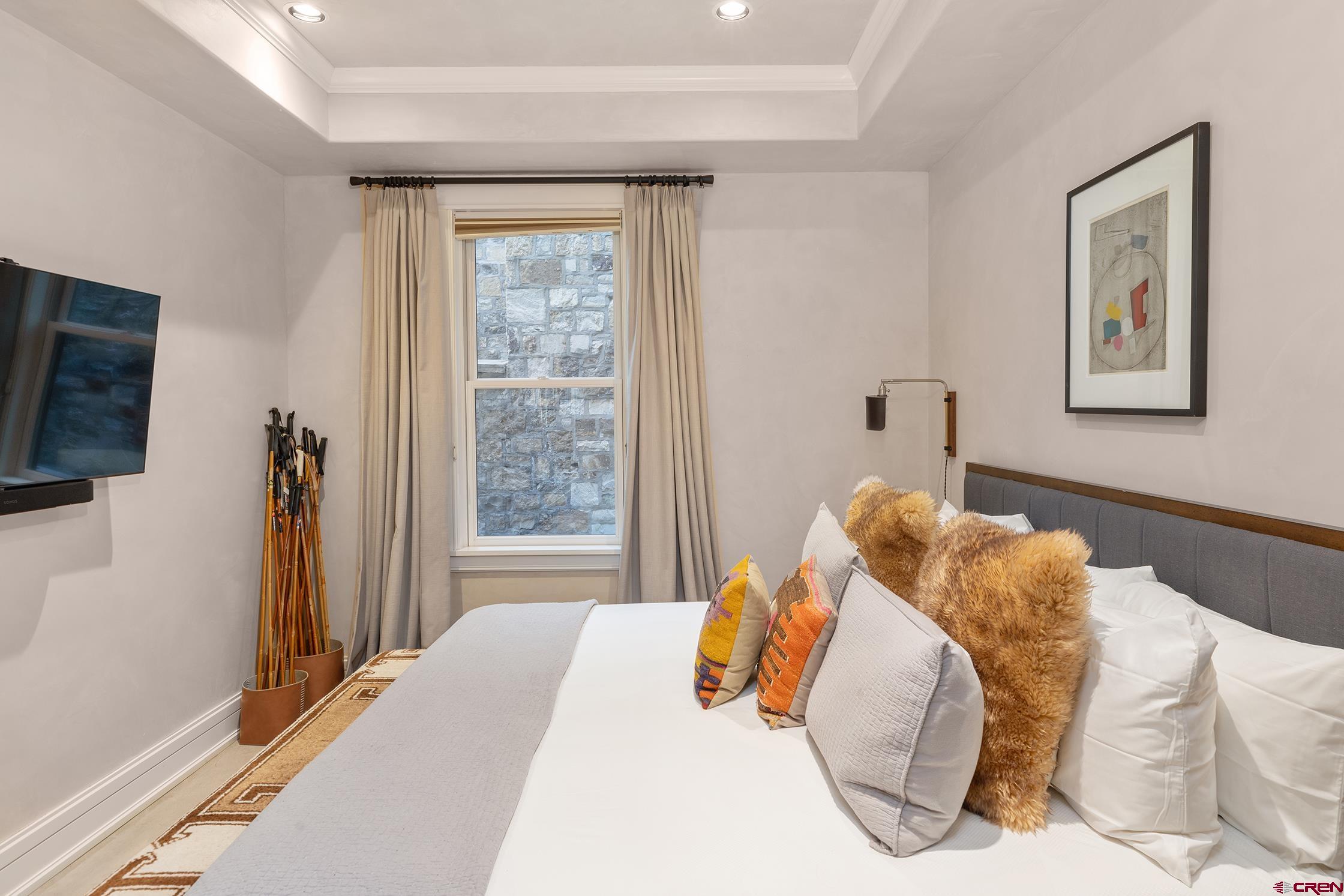 398 South Davis Street, Unit SW 201 Telluride, CO 81435 - Photo 21 of 23 a bedroom with a bed and a window