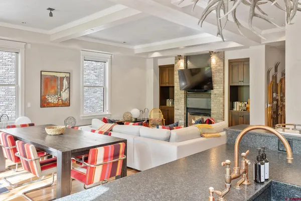 a living room with fireplace furniture and a flat screen tv