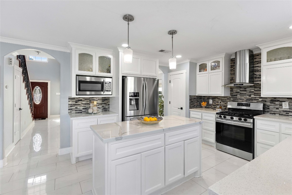 405 Mystic Trail Loop Houston, TX 77339 - Photo 11 of 44 a kitchen with stainless steel appliances granite countertop a refrigerator a stove oven and a sink