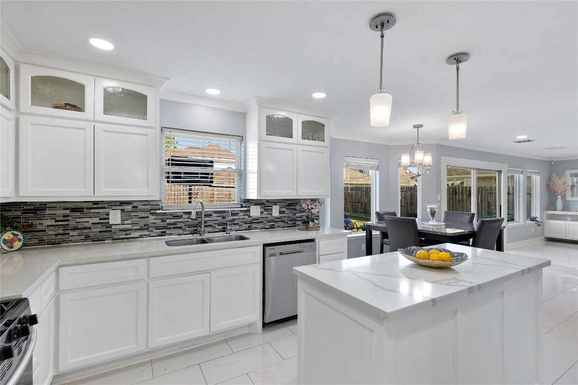 405 Mystic Trail Loop Houston, TX 77339 - Photo 18 of 44 a kitchen with stainless steel appliances granite countertop a sink a stove and a wooden cabinets