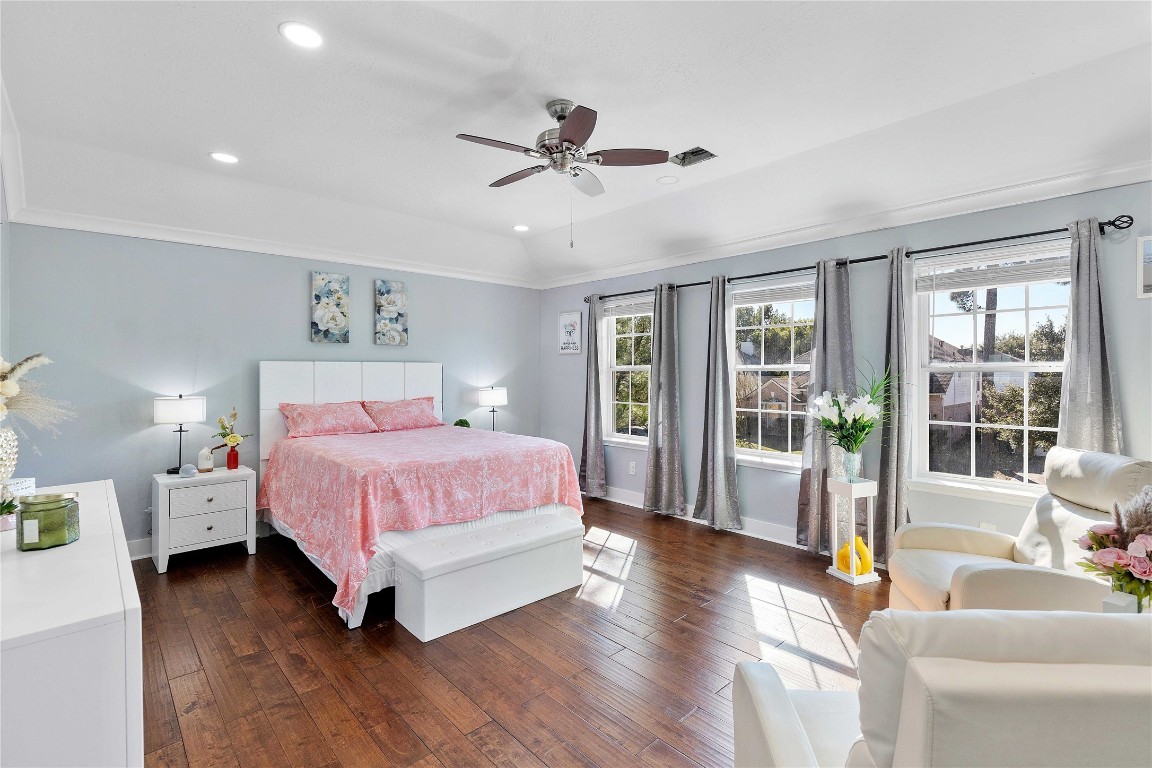 405 Mystic Trail Loop Houston, TX 77339 - Photo 21 of 44 a spacious bedroom with a bed and glass walk in closet