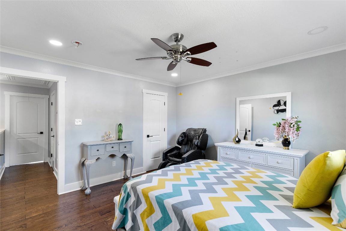 405 Mystic Trail Loop Houston, TX 77339 - Photo 33 of 44 a bedroom with a bed and wooden floor