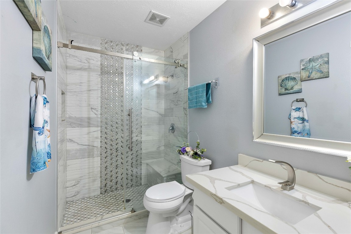 405 Mystic Trail Loop Houston, TX 77339 - Photo 34 of 44 a bathroom with a sink toilet and shower