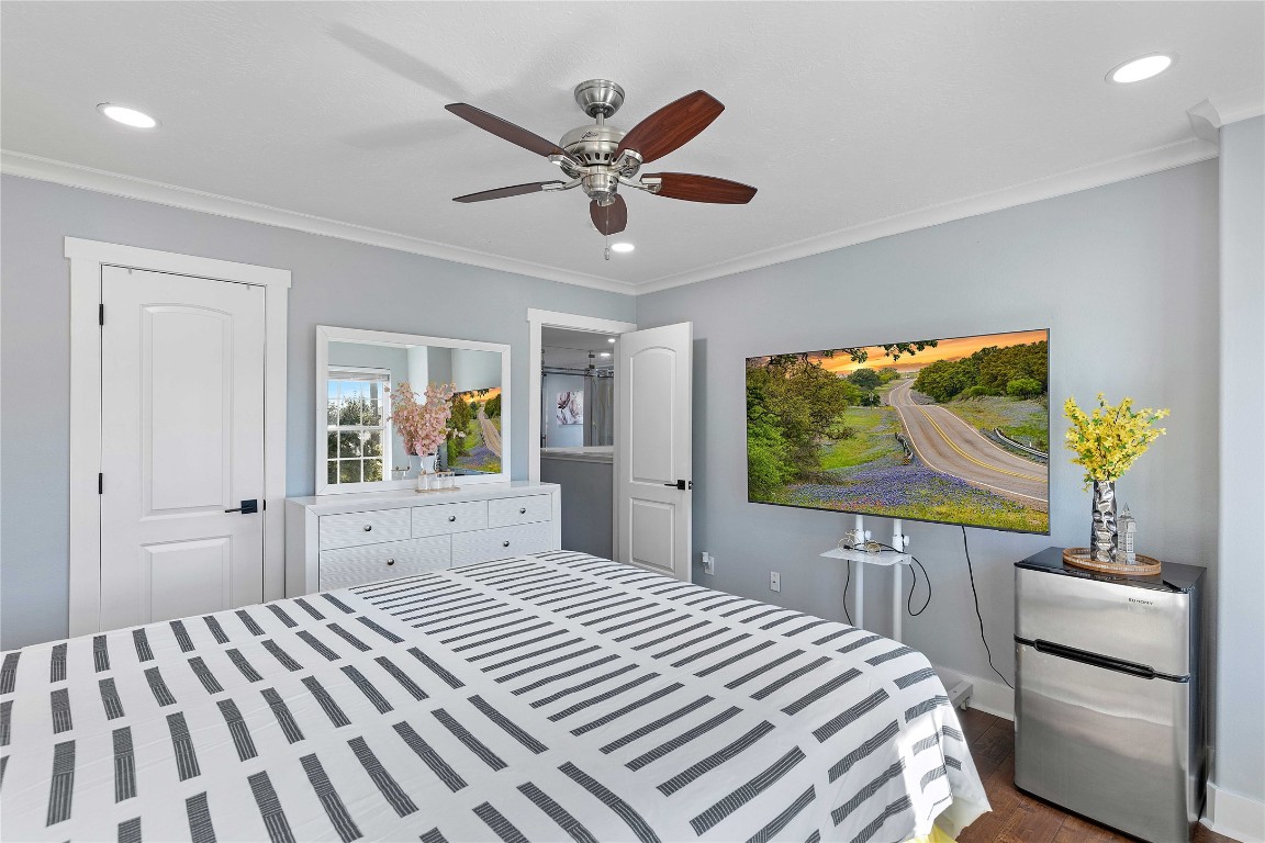 405 Mystic Trail Loop Houston, TX 77339 - Photo 36 of 44 a bedroom with a bed and a flat screen tv