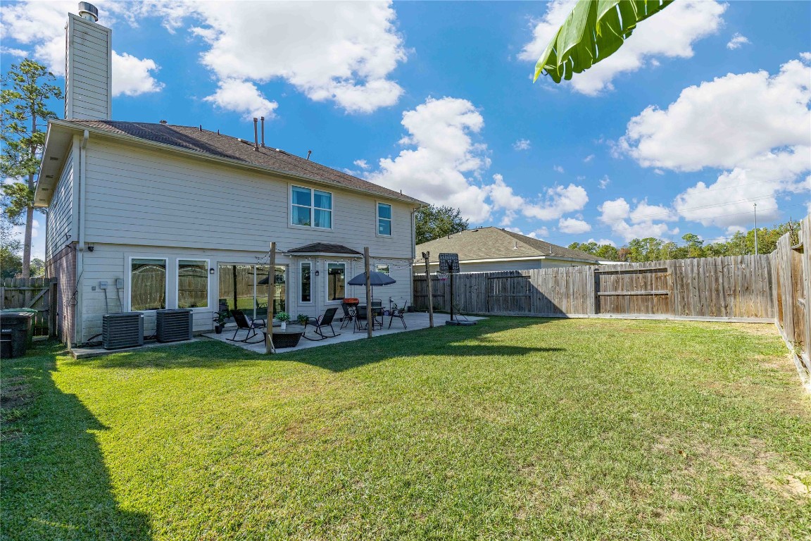405 Mystic Trail Loop Houston, TX 77339 - Photo 40 of 44 a view of a house with backyard and sitting area