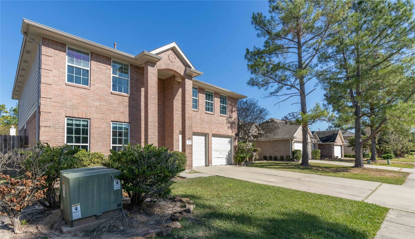 405 Mystic Trail Loop Houston, TX 77339 - Photo 43 of 44 a front view of a house with a garden