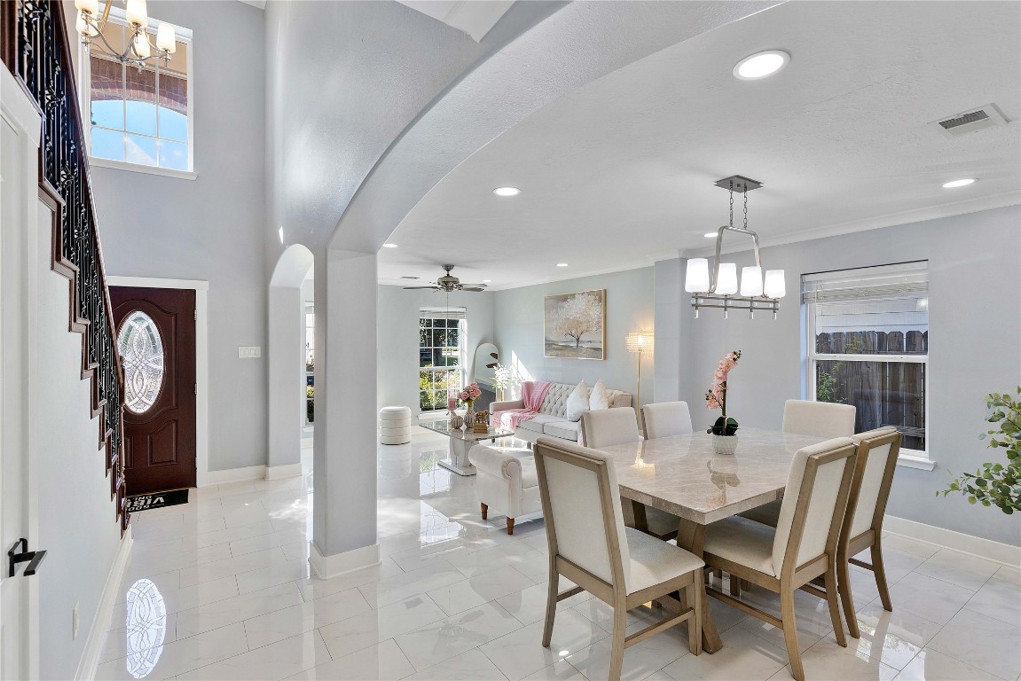 405 Mystic Trail Loop Houston, TX 77339 - Photo 6 of 44 a view of a dining room with furniture and chandelier