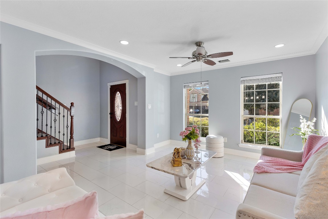 405 Mystic Trail Loop Houston, TX 77339 - Photo 7 of 44 a living room with furniture fireplace and a large window